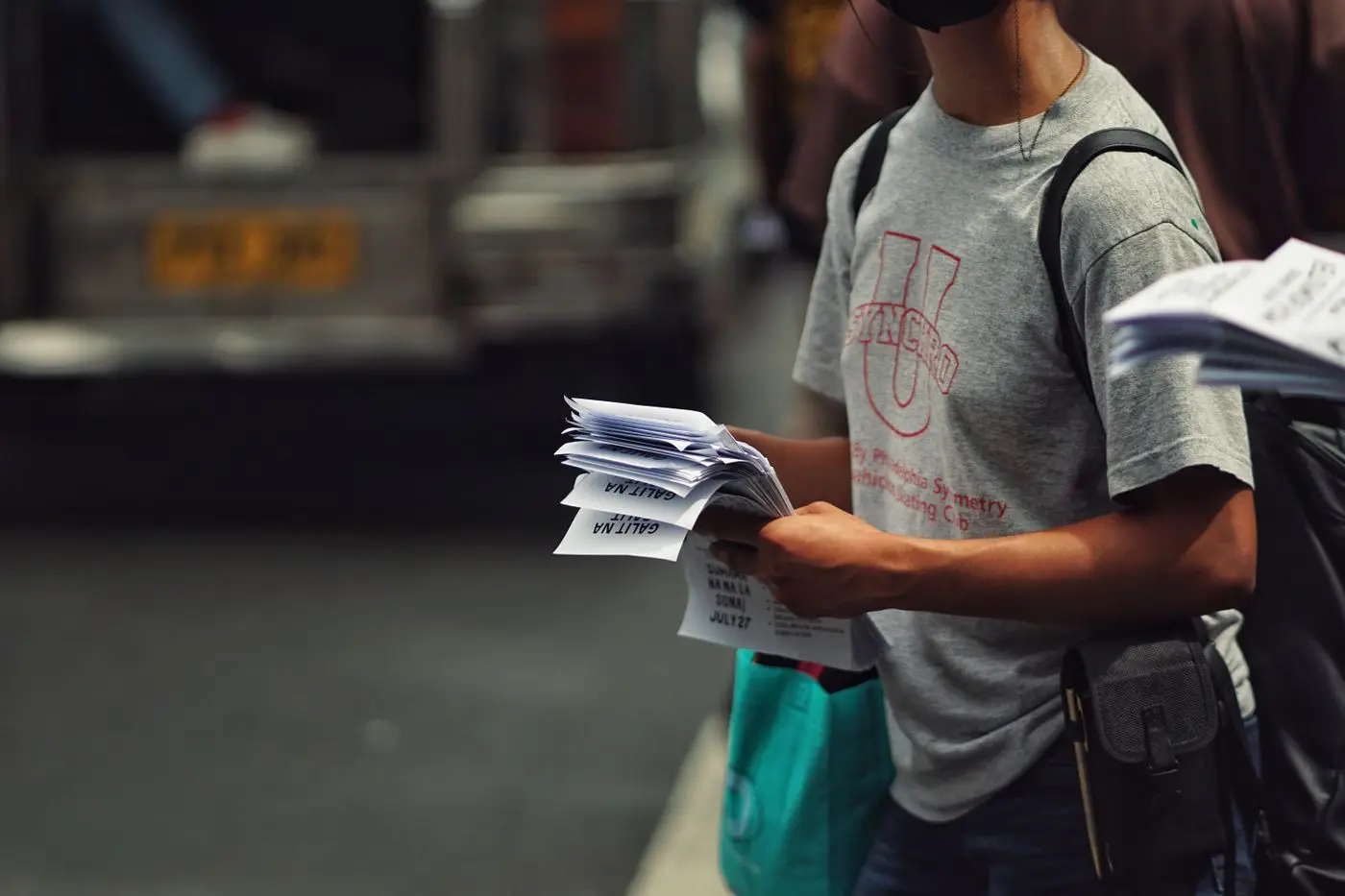 Man holding printed flyers